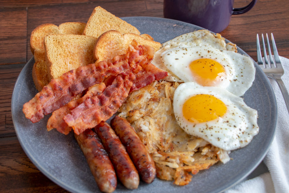 Mega Two butterflied sausages, two bacon slices, hashbrowns, two eggs and toast